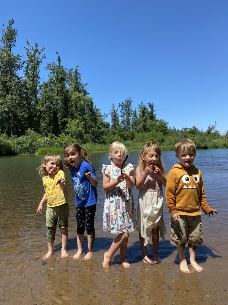Children enjoying the outdoors at Oregon Outdoor Kids nature-based preschool in Eugene, Oregon
